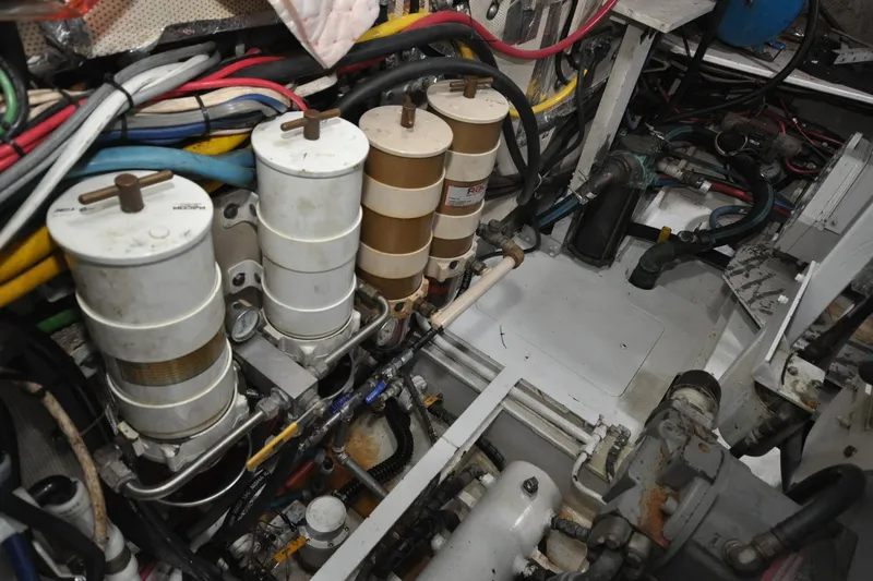In The Flow Yacht Photos Pics Engine room of 1982 Custom Virpack Steelhull with complex wiring and filtration system.