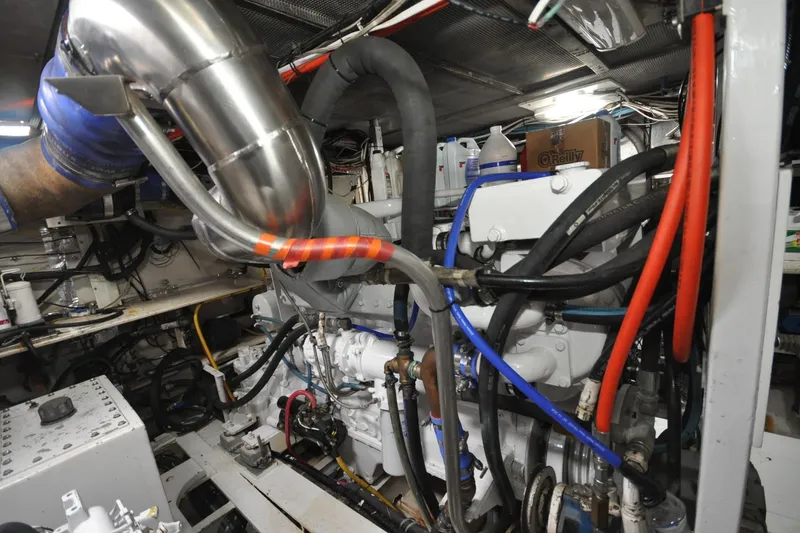 In The Flow Yacht Photos Pics Engine room of 1982 Custom Virpack Steelhull with complex piping and wiring.