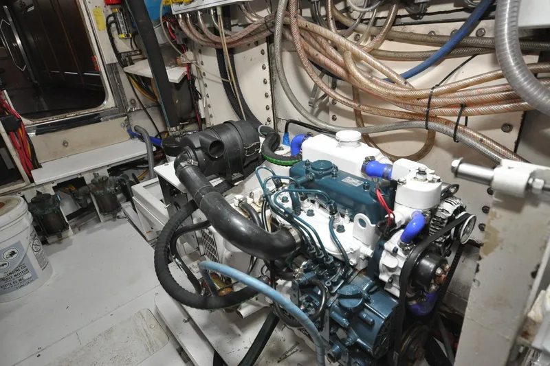 In The Flow Yacht Photos Pics Engine room of 1982 Custom Virpack Steelhull with visible machinery and wiring.