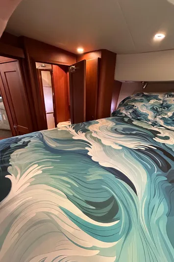Ps Thank You Yacht Photos Pics Luxurious 2004 Silverton 39 Motor Yacht bedroom with ocean-themed bedding.