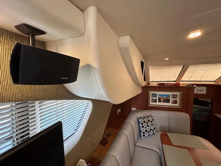 Ps Thank You Yacht Photos Pics Interior of 2004 Silverton 39 Motor Yacht with cozy seating and modern decor.