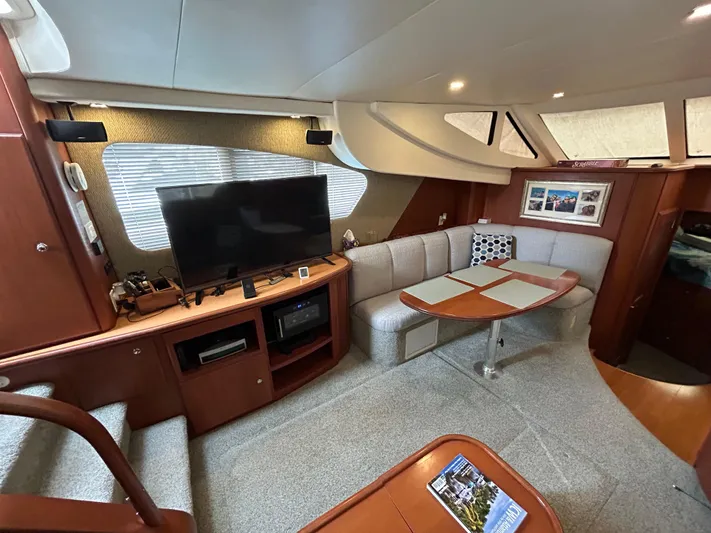 Ps Thank You Yacht Photos Pics Interior of 2004 Silverton 39 Motor Yacht with cozy seating and entertainment area.