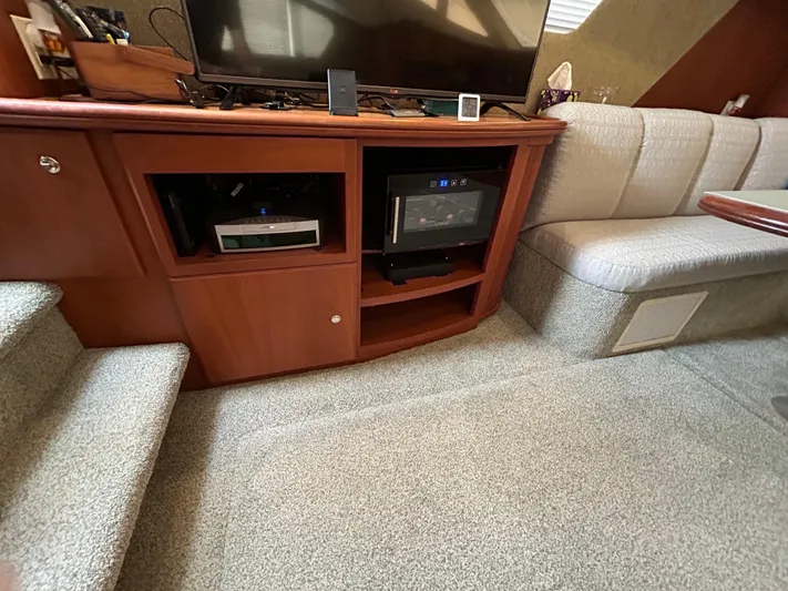 Ps Thank You Yacht Photos Pics 2004 Silverton 39 Motor Yacht interior with entertainment center and seating area.