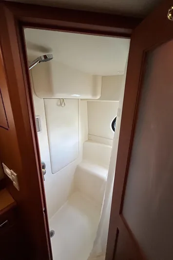 Ps Thank You Yacht Photos Pics 2004 Silverton 39 Motor Yacht shower interior with porthole and wooden door.