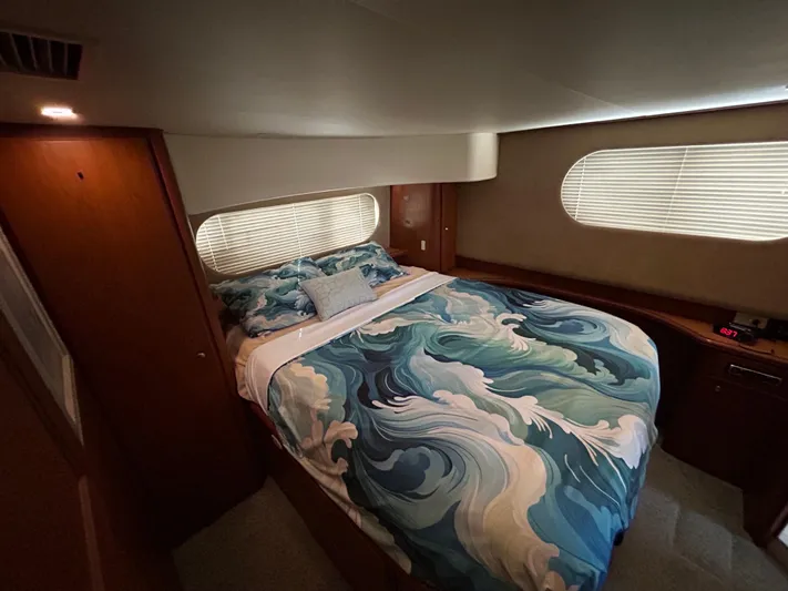 Ps Thank You Yacht Photos Pics Luxurious bedroom in 2004 Silverton 39 Motor Yacht with ocean-themed bedding.