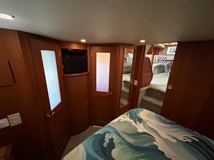 Ps Thank You Yacht Photos Pics Interior of 2004 Silverton 39 Motor Yacht with cozy bedroom and wood paneling.
