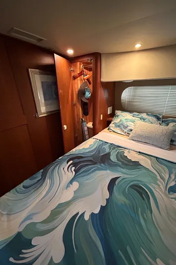 Ps Thank You Yacht Photos Pics Cozy bedroom in 2004 Silverton 39 Motor Yacht with ocean-themed bedding.