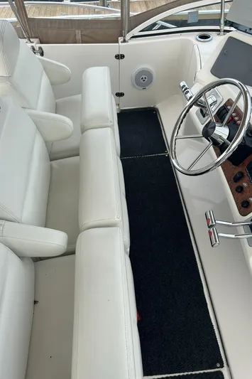 Ps Thank You Yacht Photos Pics 2004 Silverton 39 Motor Yacht interior with white seating and steering wheel.
