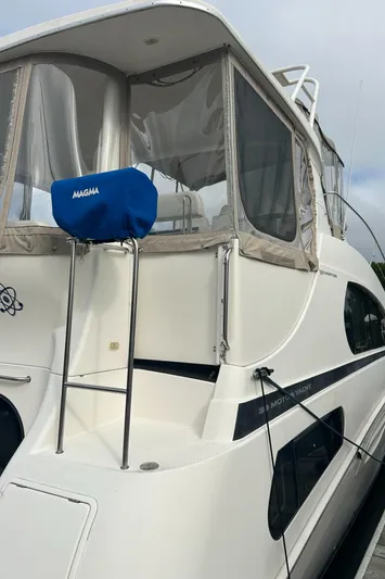 Ps Thank You Yacht Photos Pics 2004 Silverton 39 Motor Yacht with covered seating area and sleek design.