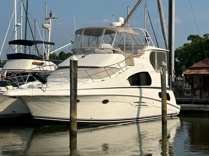 Ps Thank You Yacht Photos Pics 2004 Silverton 39 Motor Yacht docked at marina, surrounded by other boats.