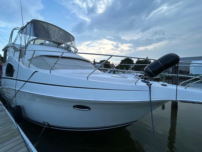 Ps Thank You Yacht Photos Pics 2004 Silverton 39 Motor Yacht docked at marina under cloudy sky.