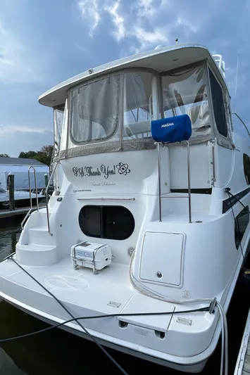 Ps Thank You Yacht Photos Pics 2004 Silverton 39 Motor Yacht docked under cloudy sky.