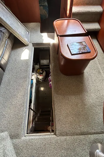 Ps Thank You Yacht Photos Pics Interior of 2004 Silverton 39 Motor Yacht with open engine hatch and table.