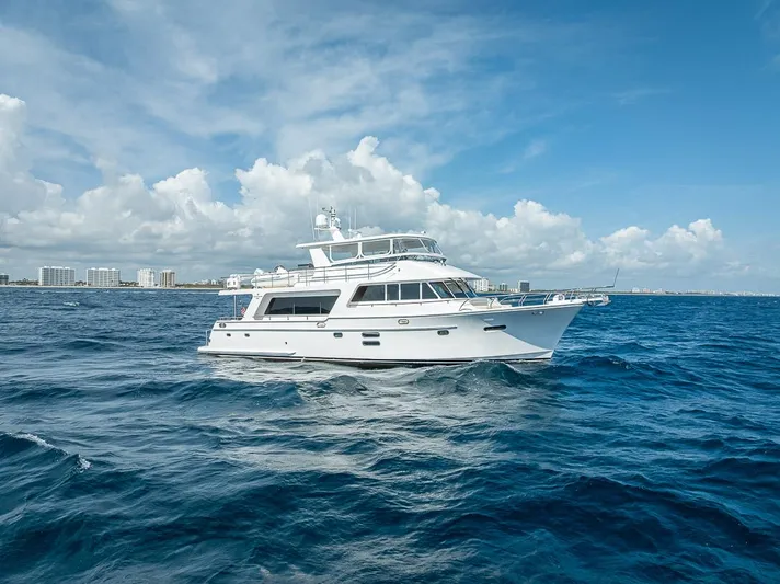 Sunny Seajay Yacht Photos Pics 2022 Hampton 658l Endurance yacht cruising on open blue sea under clear sky.