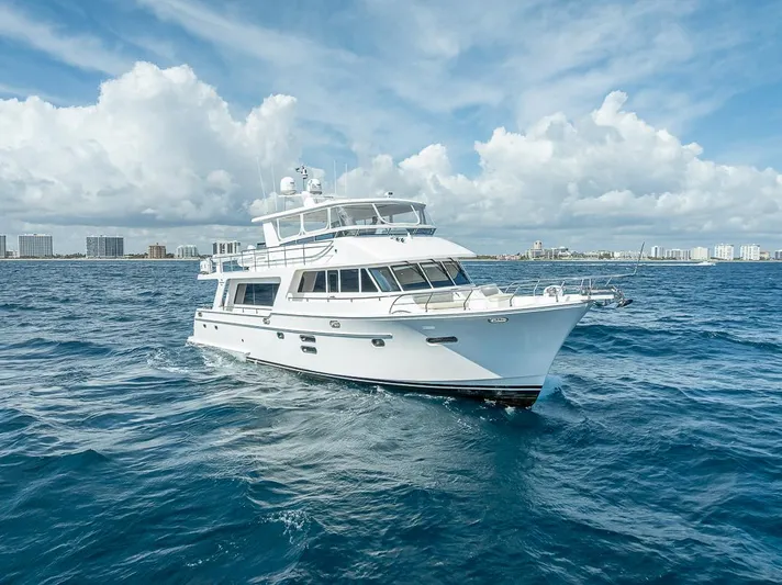 Sunny Seajay Yacht Photos Pics Luxury yacht Hampton 658l Endurance 2022 cruising on open sea under blue sky.
