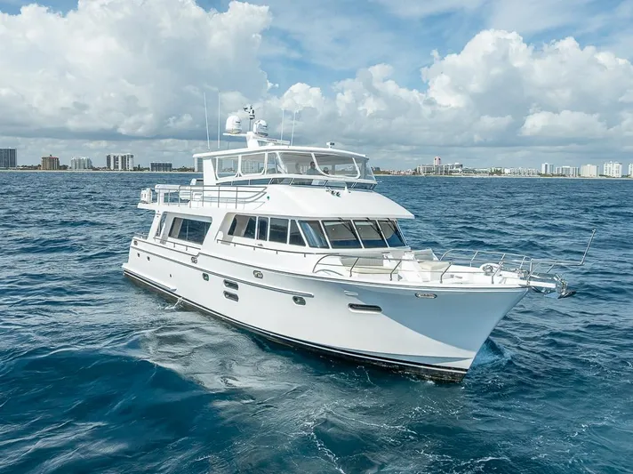 Sunny Seajay Yacht Photos Pics Luxury 2022 Hampton 658l Endurance yacht cruising on open sea under blue sky.