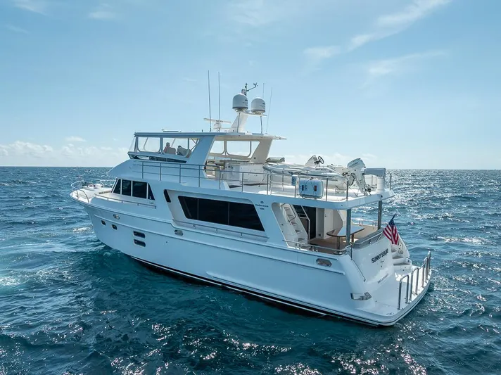 Sunny Seajay Yacht Photos Pics 2022 Hampton 658l Endurance yacht cruising on open sea under clear blue sky.