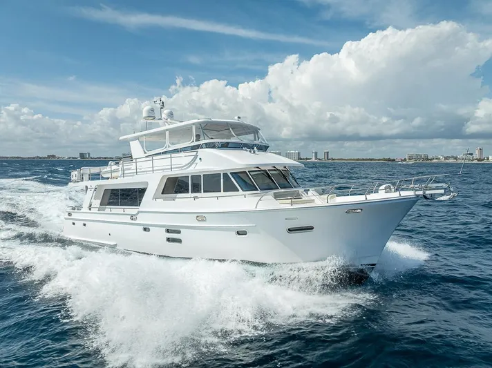 Sunny Seajay Yacht Photos Pics Luxury 2022 Hampton 658l Endurance yacht cruising on open sea under blue sky.