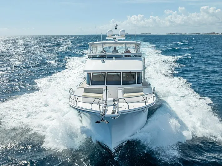 Sunny Seajay Yacht Photos Pics 2022 Hampton 658l Endurance yacht cruising on open sea under clear skies.