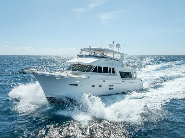 Sunny Seajay Yacht Photos Pics 2022 Hampton 658l Endurance yacht cruising on open sea under clear skies.