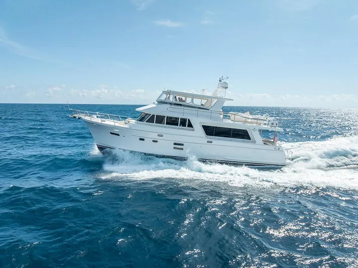 Sunny Seajay Yacht Photos Pics 2022 Hampton 658l Endurance yacht cruising on open ocean under clear skies.