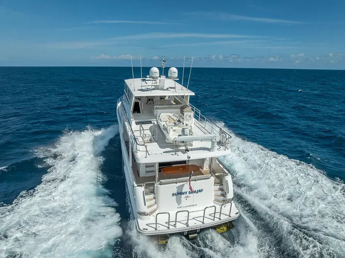 Sunny Seajay Yacht Photos Pics Luxurious 2022 Hampton 658l Endurance yacht cruising on open ocean waters.