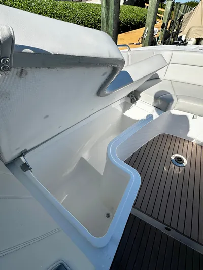 Key East Yacht Photos Pics 2023 MJM 3 boat with open storage compartment and wooden deck.