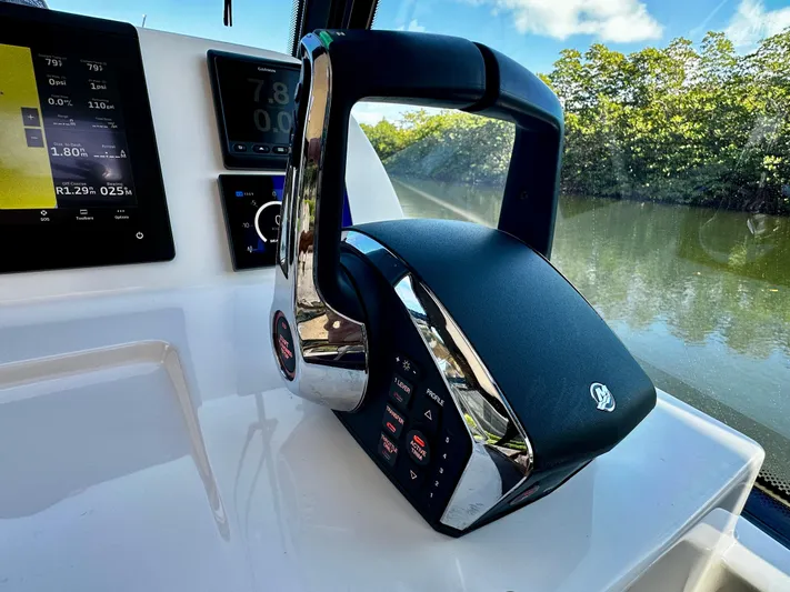 Key East Yacht Photos Pics 2023 MJM 3 boat throttle control with digital display, near scenic waterway.