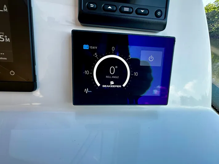 Key East Yacht Photos Pics Seakeeper control panel on 2023 MJM 3 boat dashboard, displaying roll angle.