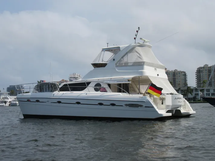 Africa 3 Yacht Photos Pics 2008 Africat Marine 420 yacht on water, featuring sleek design and German flag.