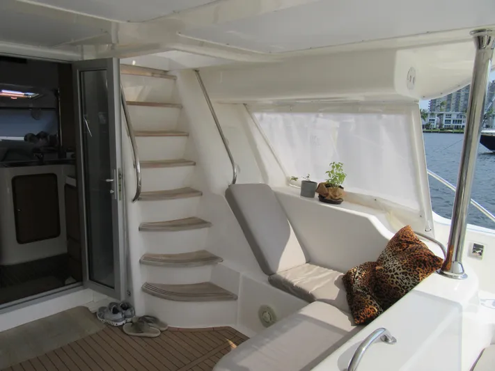 Africa 3 Yacht Photos Pics Luxurious 2008 Africat Marine 420 yacht interior with cozy seating and elegant staircase.