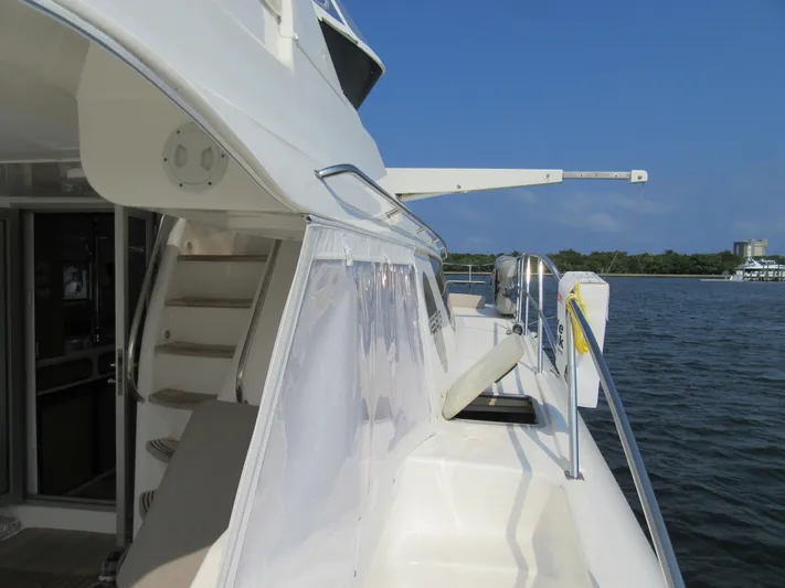 Africa 3 Yacht Photos Pics Africat Marine 420 yacht, 2008 model, docked by the water on a sunny day.