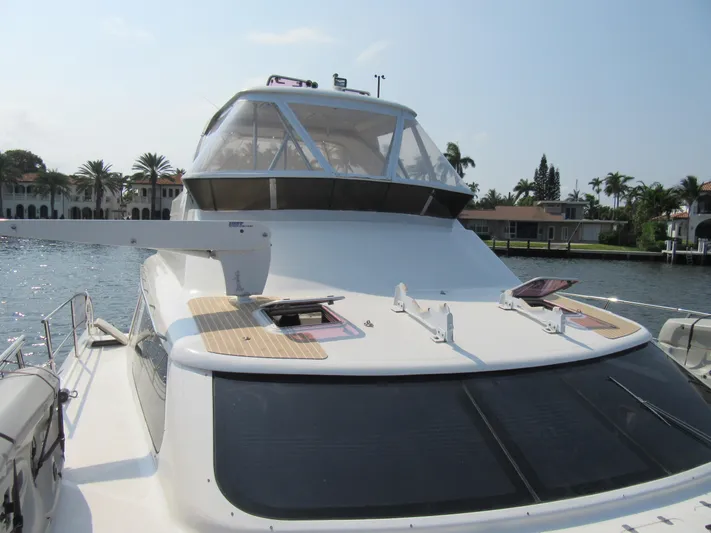 Africa 3 Yacht Photos Pics Africat Marine 420 yacht, 2008 model, docked in a scenic waterfront location.