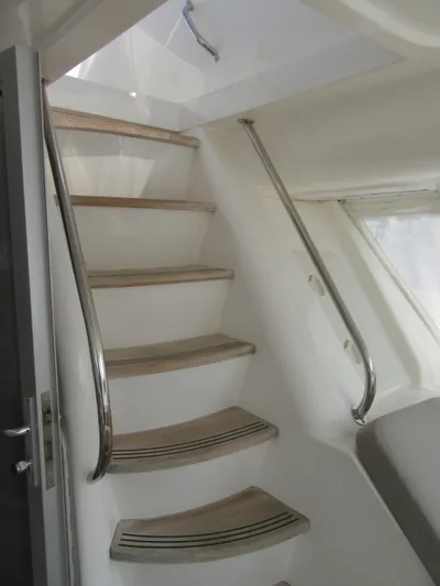 Africa 3 Yacht Photos Pics Staircase inside 2008 Africat Marine 420 yacht with sleek metal railings.