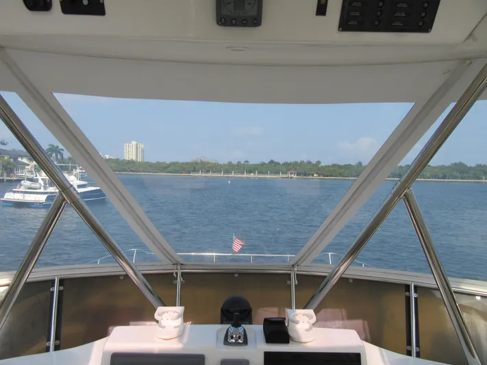 Africa 3 Yacht Photos Pics View from Africat Marine 420 yacht, 2008 model, overlooking calm waters and distant shoreline.