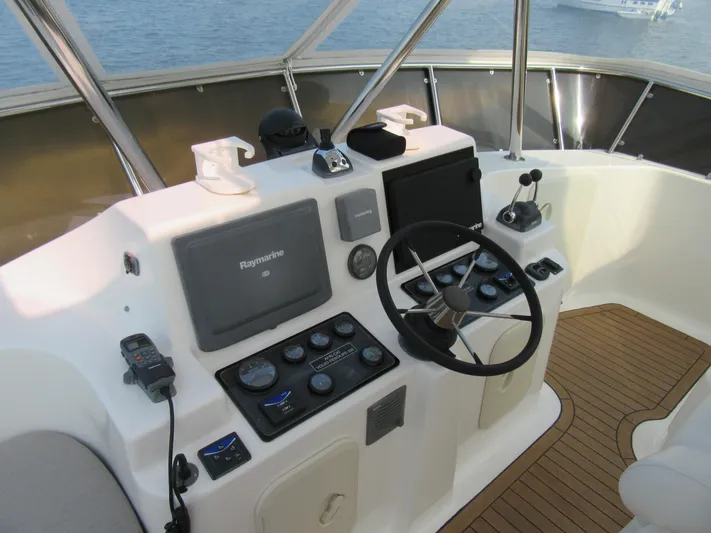 Africa 3 Yacht Photos Pics Africat Marine 420 helm, 2008 model, featuring navigation controls and steering wheel.