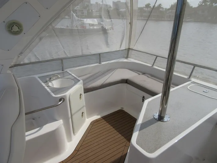 Africa 3 Yacht Photos Pics 2008 Africat Marine 420 boat interior with seating and sink, overlooking water.