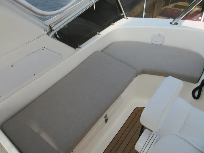 Africa 3 Yacht Photos Pics Africat Marine 420 boat interior, 2008 model, featuring cushioned seating and wooden flooring.