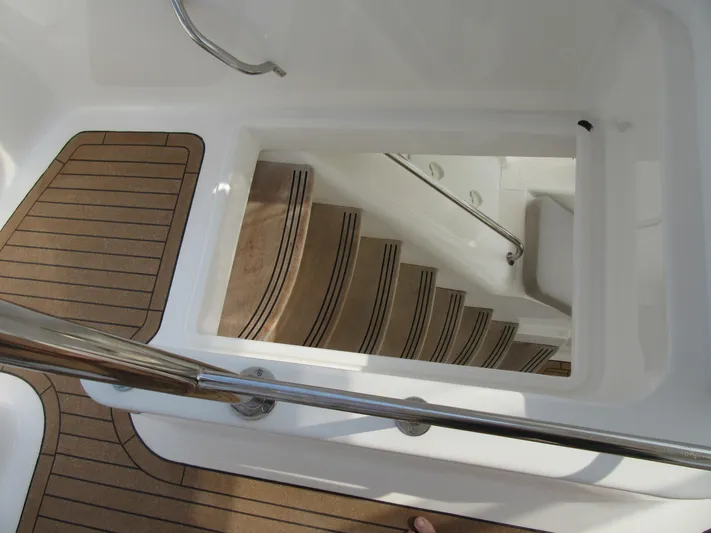 Africa 3 Yacht Photos Pics Staircase on 2008 Africat Marine 420 yacht with wooden flooring and metal handrails.