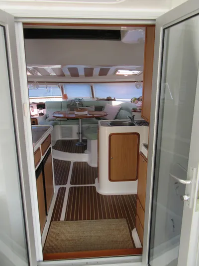 Africa 3 Yacht Photos Pics Interior view of 2008 Africat Marine 420 yacht, featuring modern kitchen and seating area.