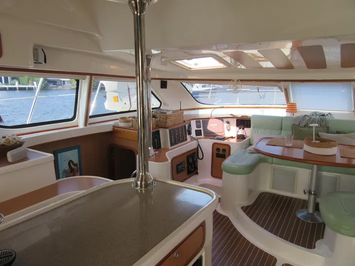 Africa 3 Yacht Photos Pics Interior of 2008 Africat Marine 420 catamaran with modern seating and navigation area.