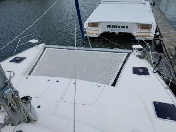 Titan 46 Yacht Photos Pics Catamaran docked at marina, Leopard 46 model, 2011, with visible netting and deck.