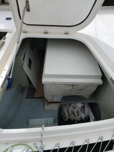Titan 46 Yacht Photos Pics Open storage compartment on a 2011 Leopard 46 boat, containing ropes and equipment.