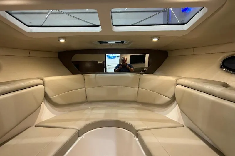 Yacht Photos Pics Interior of 2017 Regal 30 Express boat with beige seating and skylights.