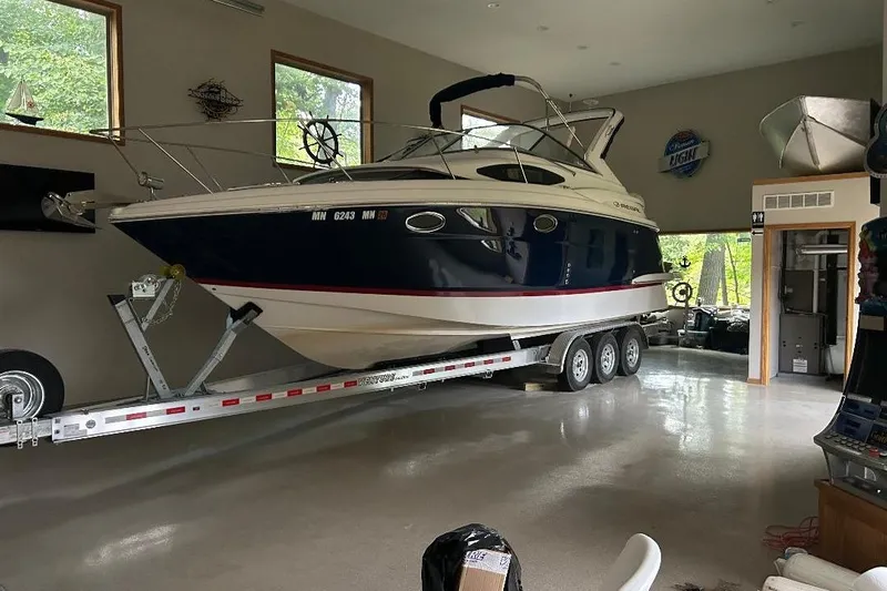  Yacht Photos Pics 2017 Regal 30 Express boat on trailer in a spacious garage.