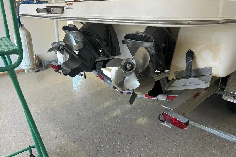  Yacht Photos Pics 2017 Regal 30 Express boat with dual propellers in a garage setting.