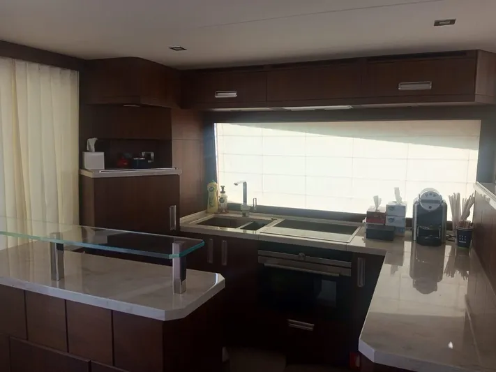 Sadeen Yacht Photos Pics Luxurious kitchen interior of 2016 Galeon 550 Fly yacht with modern appliances and sleek design.
