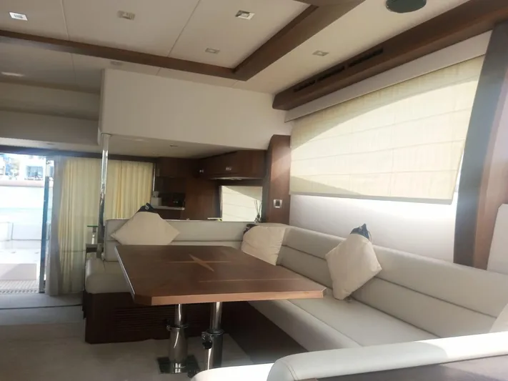 Sadeen Yacht Photos Pics Interior of 2016 Galeon 550 Fly yacht with elegant seating and dining area.