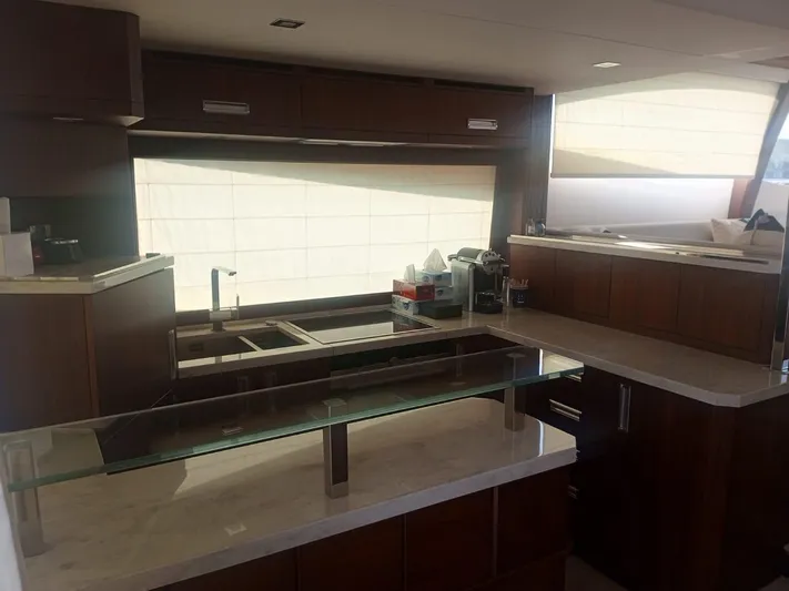 Sadeen Yacht Photos Pics Interior of 2016 Galeon 550 Fly yacht kitchen with modern cabinetry and countertops.
