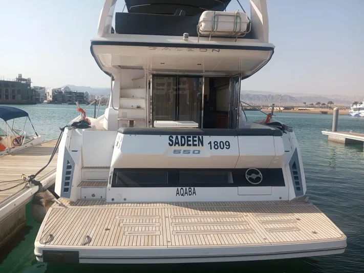 Sadeen Yacht Photos Pics Galeon 550 Fly 2016 yacht docked at marina, rear view, with "Sadeen" and "Aqaba" visible.